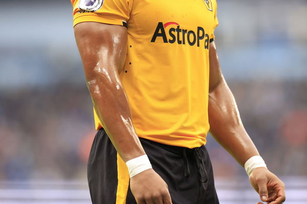 Premier League Manchester City v Wolverhampton Wanderers Adama Traore 37 of Wolverhampton Wanderers coats his arms in oi