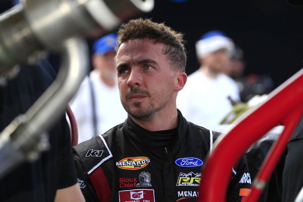 DAYTONA, FL &#8211; FEBRUARY 17: Frankie Muniz ( 30 Hairclub-Ford Performance Ford) talks with his crew during qualifying for