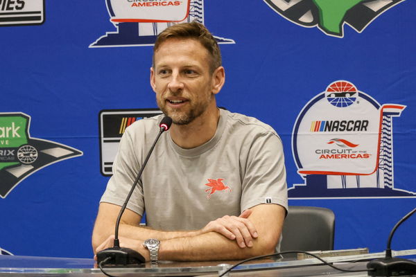 AUSTIN, TX &#8211; MARCH 24: Jenson Button ( 15 Rick Ware Racing Mobil 1 Ford) talks to the media after practice for the NASCA