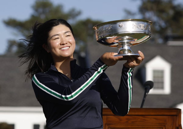 Rose Zhang holds the championship trophy after winning the Augusta National Women s Amateur in a playoff over Jenny Bae