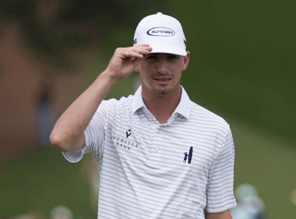 Amateur Sam Bennett tips his cap after a birdie on the ninth hole during the second round at the Masters tournament at A