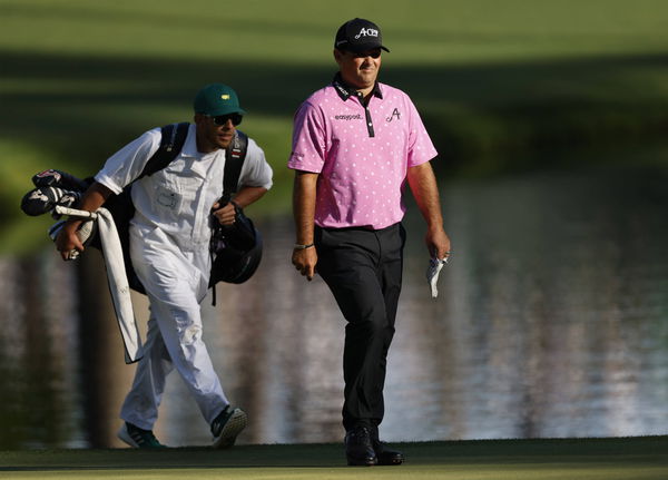 Patrick Reed and caddie Kessler Karain walk to the 16th green during the final round at the 87th Masters tournament at A