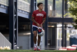 FOXBOROUGH, MA – JULY 26: New England Patriots cornerback Christian Gonzalez (50) arrives during the opening day of New
