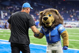 Syndication: Detroit Free Press Lions coach Dan Campbell shakes hands with mascot Roary before a preseason game against