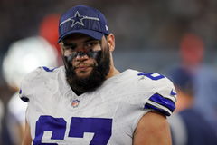 ARLINGTON, TX &#8211; AUGUST 12: Dallas Cowboys center Brock Hoffman (67) walks the sidelines during the preseason game betwee