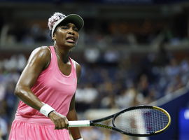 Venus Williams reacts after losing a point to Greet Minnen of Belgium before being defeated in straight sets in the firs