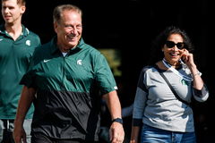 Syndication: Detroit Free Press Michigan State basketball head coach Tom Izzo and his wife Lupe Izzo, right, walk out of