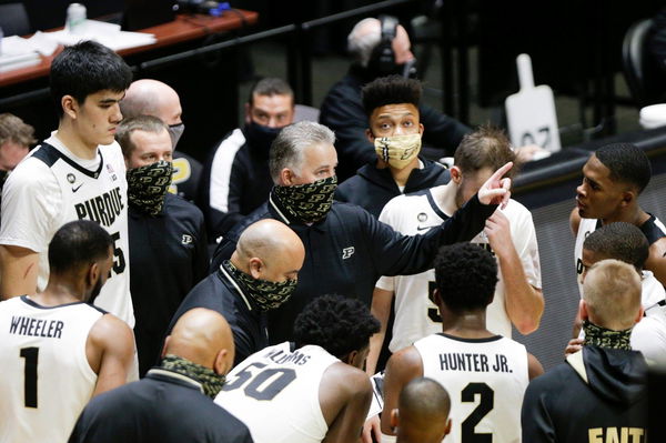 Syndication: Journal-Courier Purdue head coach Matt Painter talks with his team during a timeout in the second half of a