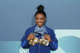 Olympics: Gymnastics Aug 5, 2024; Paris, France; Simone Biles of the United States poses for a photo with her three gold