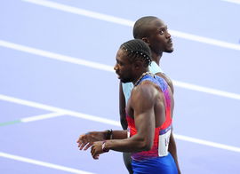 (240808) &#8212; PARIS, Aug. 8, 2024 &#8212; Noah Lyles (L) of the United States and Letsile Tebogo of Botswana react after the me