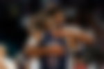 LeBron James and Joel Embiid hugging it out at the Paris Olympics