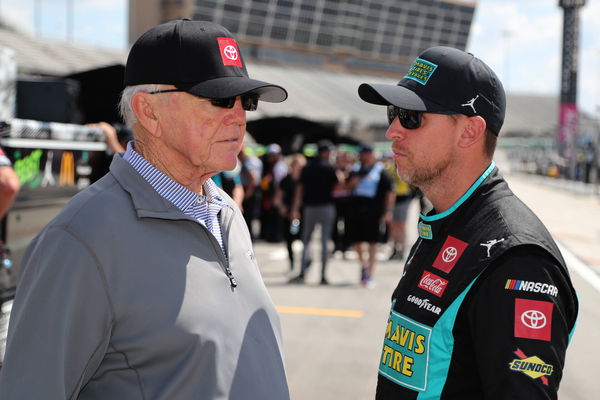 ATLANTA, GA &#8211; SEPTEMBER 07: Denny Hamlin ( 11 Joe Gibbs Racing Mavis Tire Toyota) talks with team owner Joe Gibbs on pit