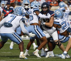 October 26, 2024: Virginia Cavaliers TE 16 Tyler Neville is caught by the Tar Heel defense during NCAA, College League,