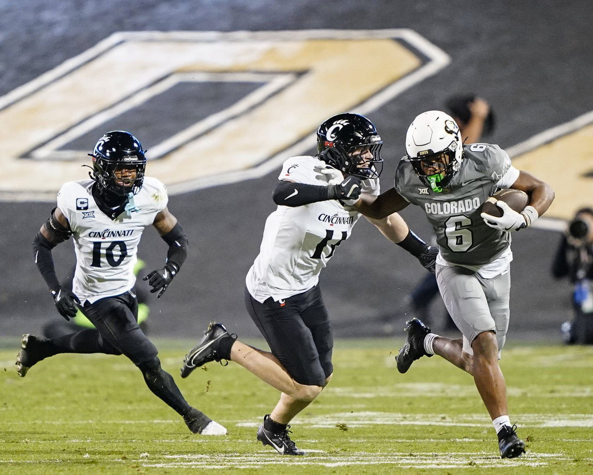 NCAA, College League, USA Football 2024: Cincinatti vs Colorado OCT 26 October 26, 2024: Cincinnati Bearcats linebacker Jake Golday 11 tries to tackle Colorado Buffaloes wide receiver Drelon Miller 6 in the first half of the football game between Colorado and Cincinnati in Boulder, CO. Derek Regensburger/CSM. Credit Image: Derek Regensburger/Cal Media EDITORIAL USE ONLY Copyright: xx ZUMA-20241026_zma_c04_823.jpg DerekxRegensburgerx csmphotothree311222