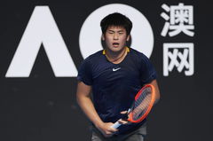 CHENGDU, CHINA &#8211; NOVEMBER 27: Li Wenfu of China reacts in the Men s Singles Round of 16 match against Sun Fajing of Chin