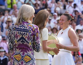 Catherine, Princess of Wales, Patron of The AELTC talks to Amanda Anisimova of United States of America after the Ladies