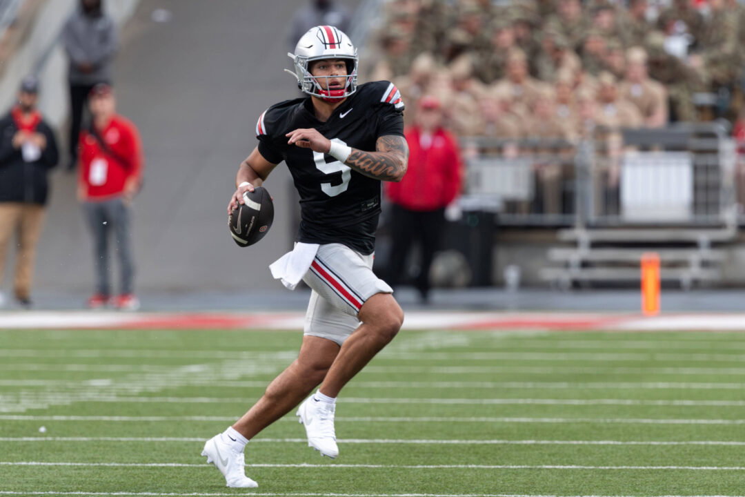 Ohio State quarterback Tavien St. Clair 9 rolls out during the spring game between the Ohio State Buckeyes Scarlet and Ohio State Buckeyes Gray teams at Ohio Stadium, Columbus, Ohio