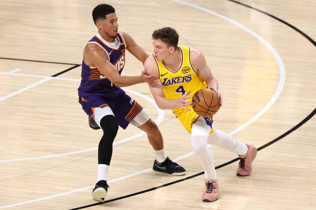 Los Angeles Lakers forward Dalton Knecht R drives the ball down the court against Phoenix Suns guard Devin Booker L during the NBA preseason game between the Los Angeles Lakers and the Phoenix Suns in Palm Desert, California, USA, 03 October 2025