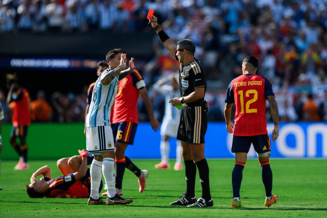 Enzo Fernandez of Argentina is shown a red card by Referee Slavko Vincic during the FIFA World Cup