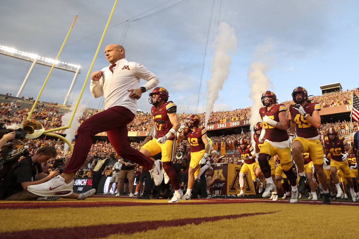 Fans Storm Field, $500K Fine at Risk & Head Coach Goes Bonkers in Locker Room as Minnesota Beats Michigan After 49 Years at Home
