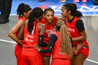 Angel Reese with her teammates