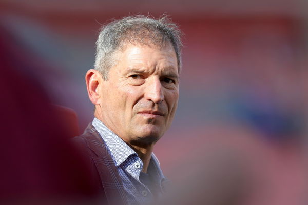 Former Cleveland Brown Bernie Kosar looks on prior to the Browns preseason game against the Washingt