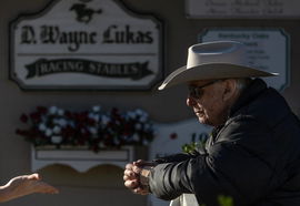Syndication: The Courier-Journal Trainer D. Wayne Lukas, 88, talks with the media outside his barn on the backside of Ch