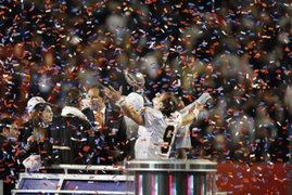 07 February 2010: New Orleans Saints quarterback Drew Brees celebrates on the podium after the New Orleans Saints 31-17