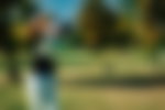 Golf swing with the drive, shot from behind