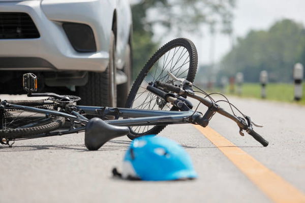 Accident car crash with bicycle on road