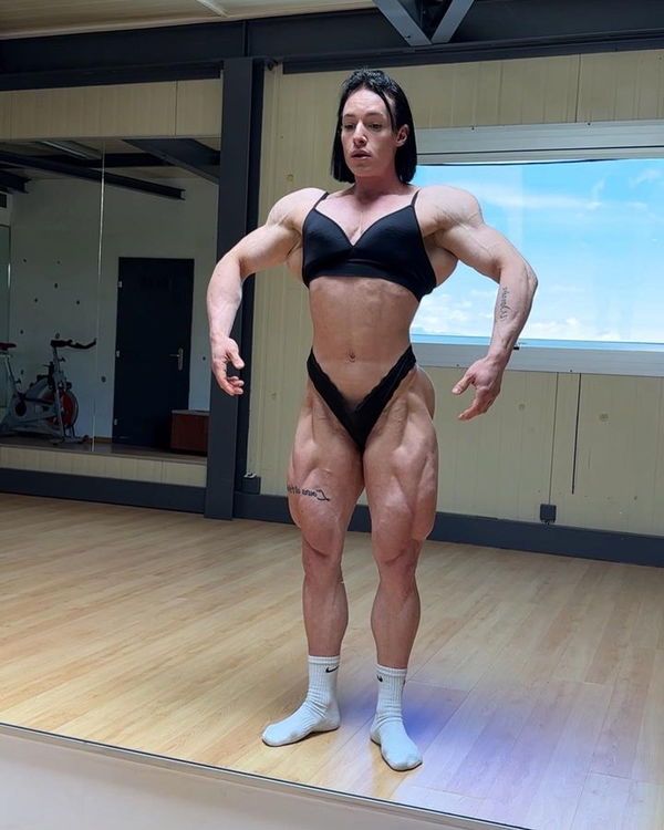 extremly huge and muscular female bodybuilder with a