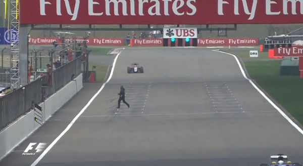 Man runs across the track, 2015 Chinese GP