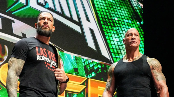 The Rock lays down a challenge for WrestleMania 40 - his first match in  eight years - TEAMING with Roman Reigns… but WWE fans notice his strange  Bloodline signal