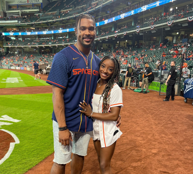 Simone Biles at Packers vs Bengals game, rocking Jonathan Owens jersey